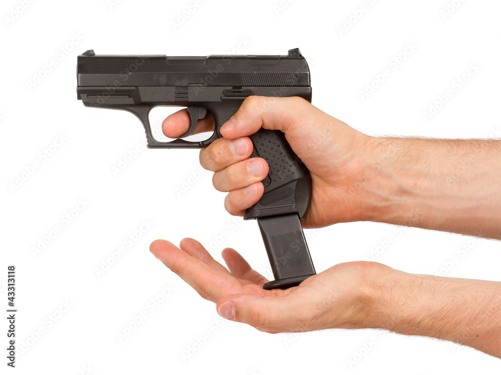 Woman loading a black gun Woman loading a black gun