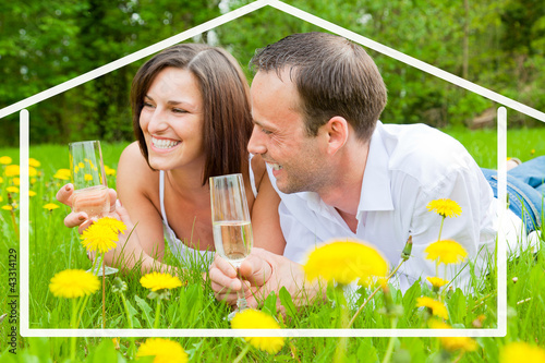 paar in der natur mit sekt photo