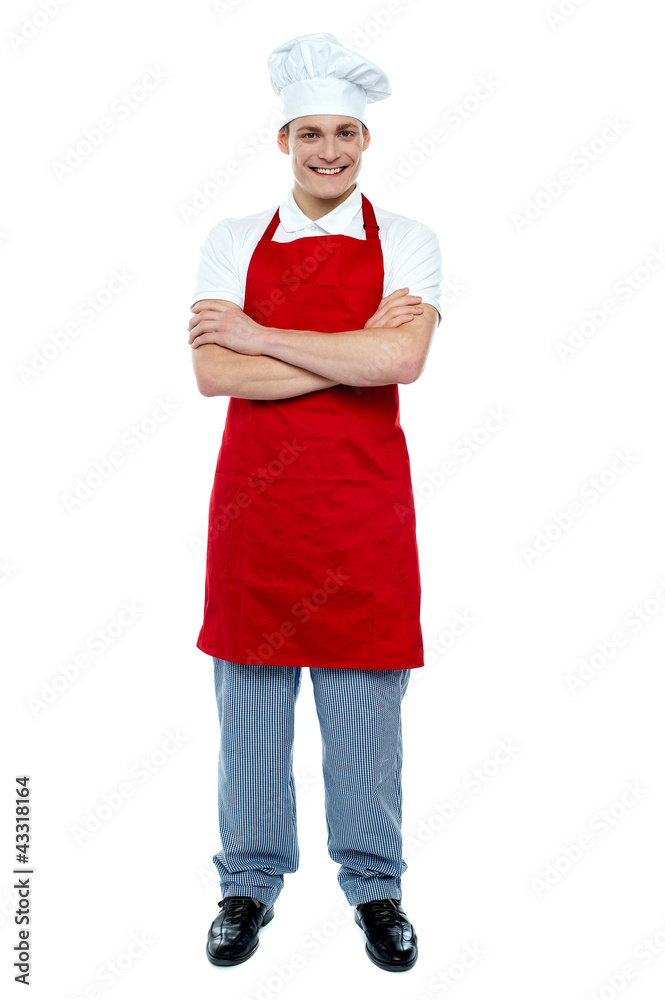 Handsome young cook posing in uniform Handsome young cook posing in uniform