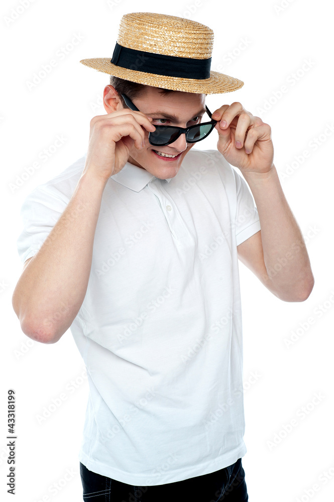Man looking from behind sunglasses and smiling Man looking from behind sunglasses and smiling
