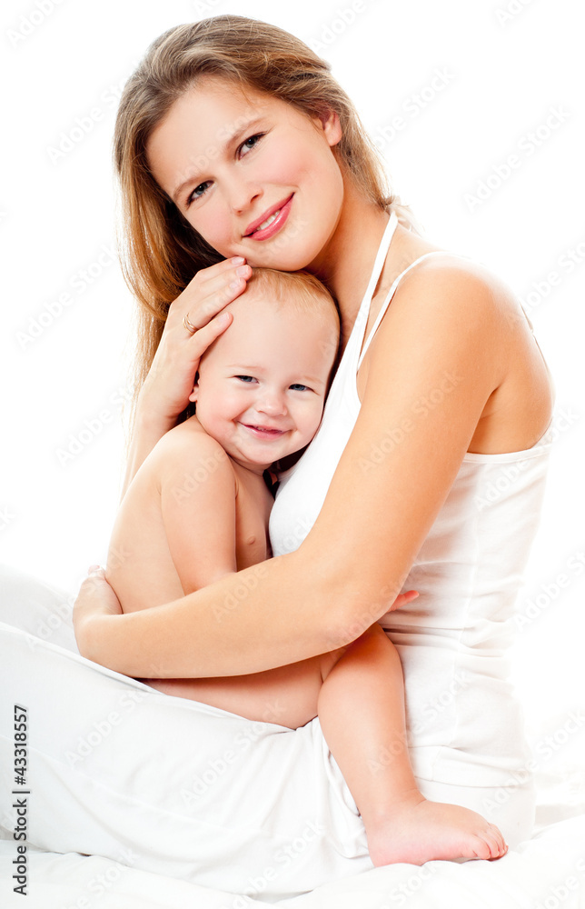 Obraz premium Young mother hugging baby