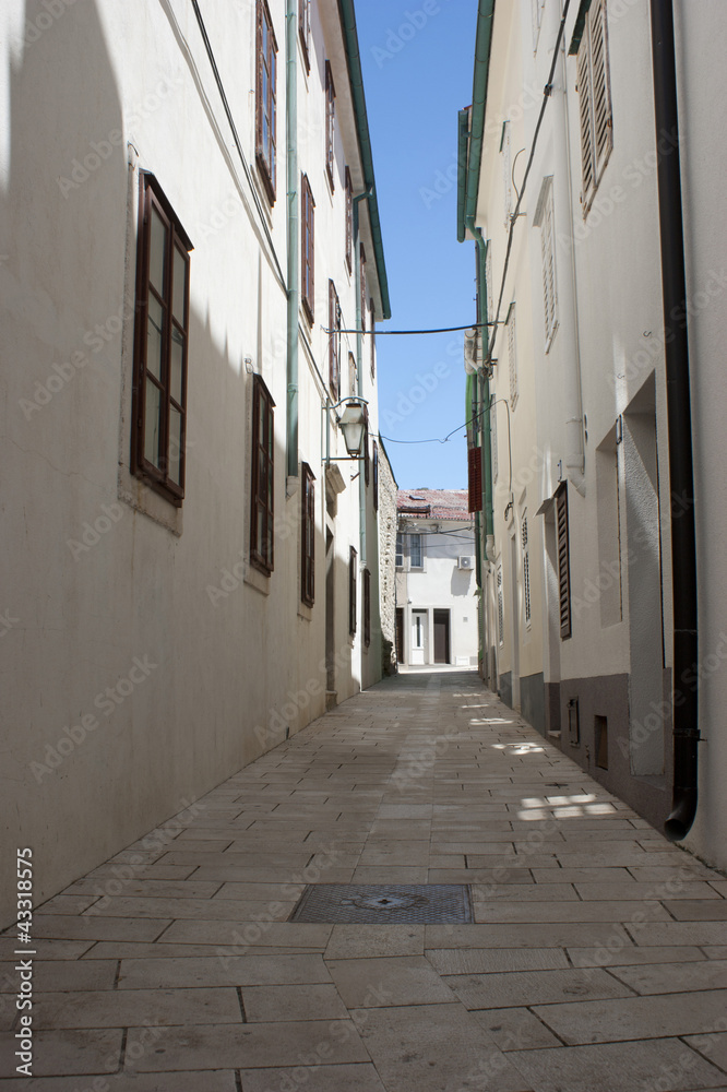 Fototapeta premium Cute street in city Pag in Croatia