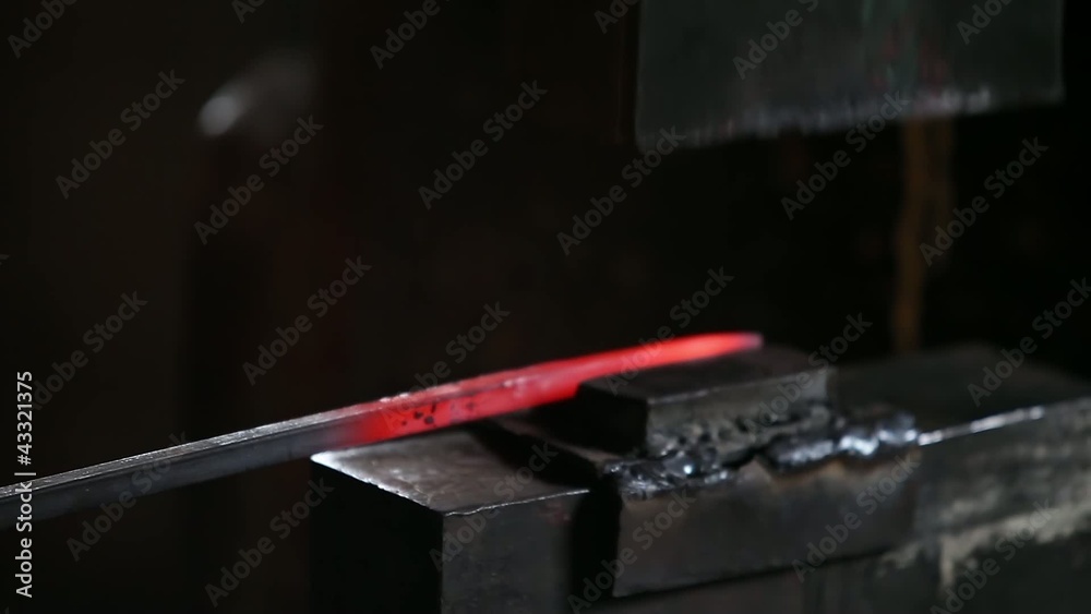 smith working with hot metal on anvil smith working with hot metal on anvil