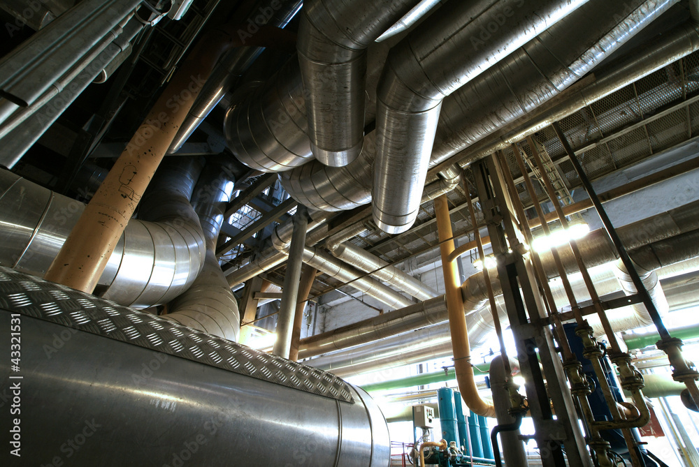 different size and shaped pipes and valves at a power plant different size and shaped pipes and valves at a power plant