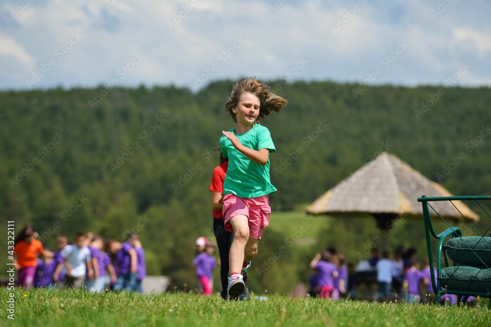 happy kids group  have fun in nature