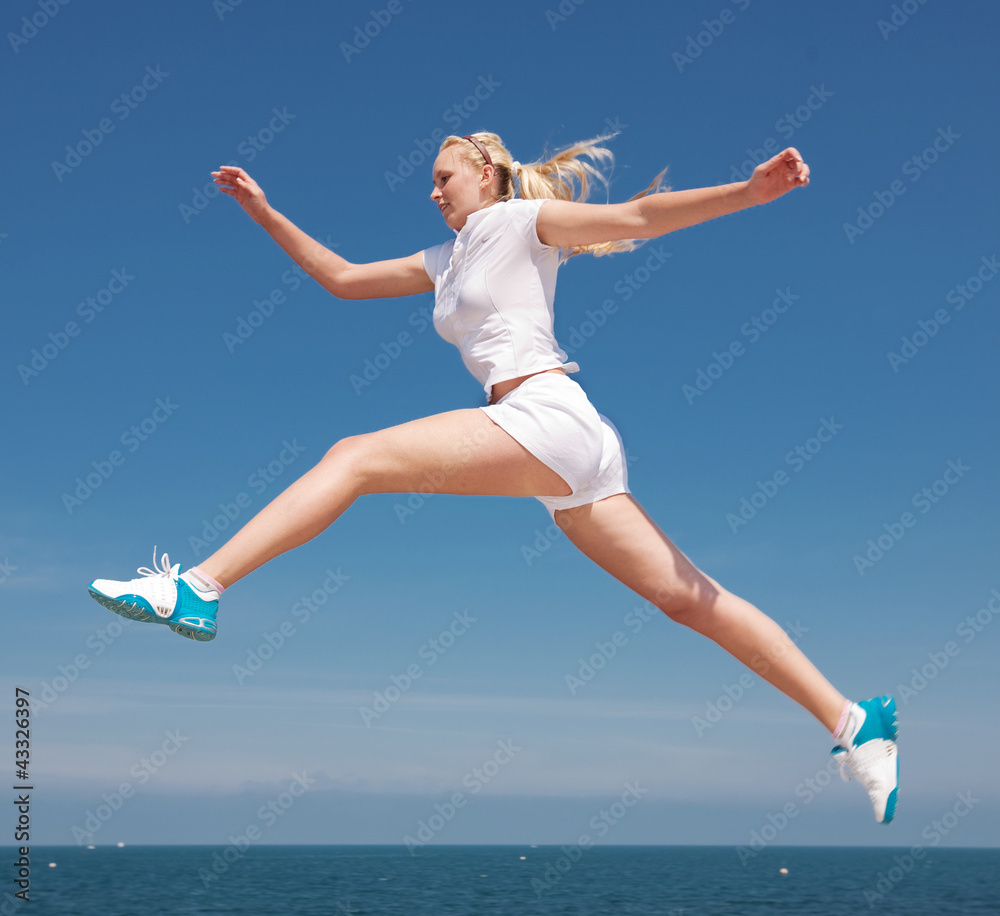 Sportswoman running outdoors