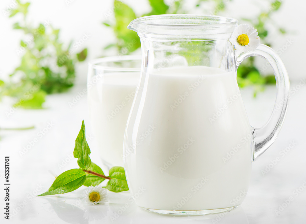 Glass jug and glass with milk Glass jug and glass with milk