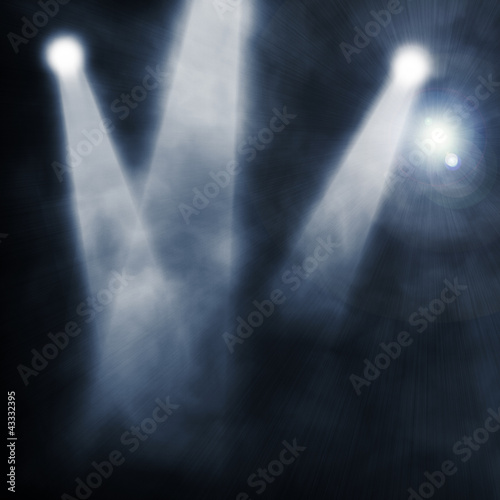 Spotlight  blue on smog background