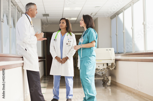 Doctors and nurse talking in hospital