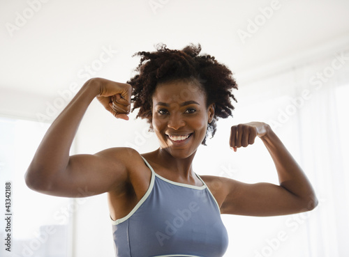 Black woman flexing biceps photo