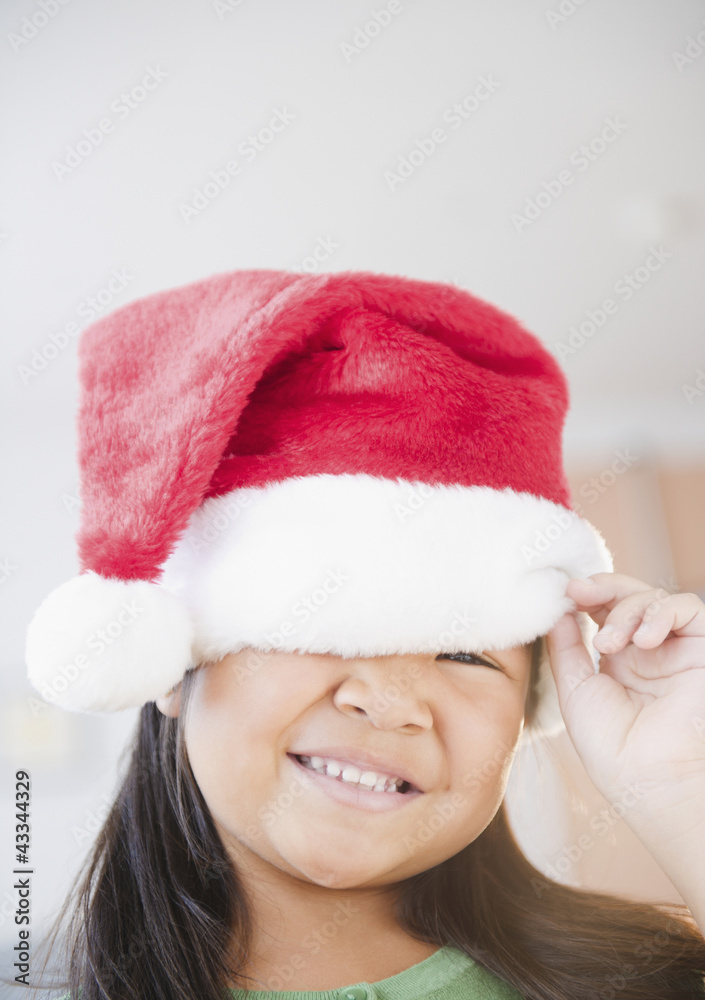 Korean girl wearing Santa hat Korean girl wearing Santa hat