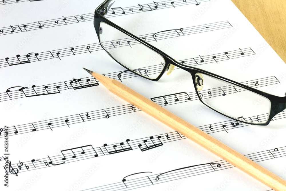 music sheet with pencil and glasses music sheet with pencil and glasses