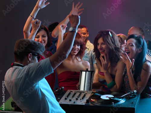 women flirting with dj in night club