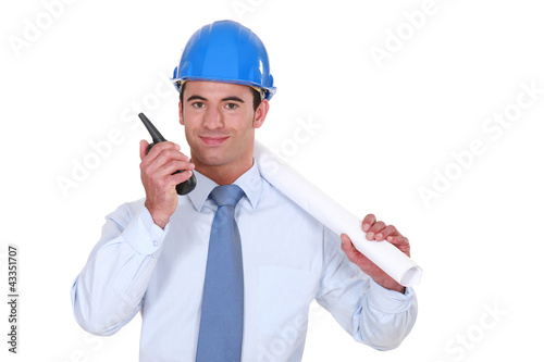 Architect with a two-way radio