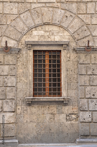 Lattice in a window in stone wall