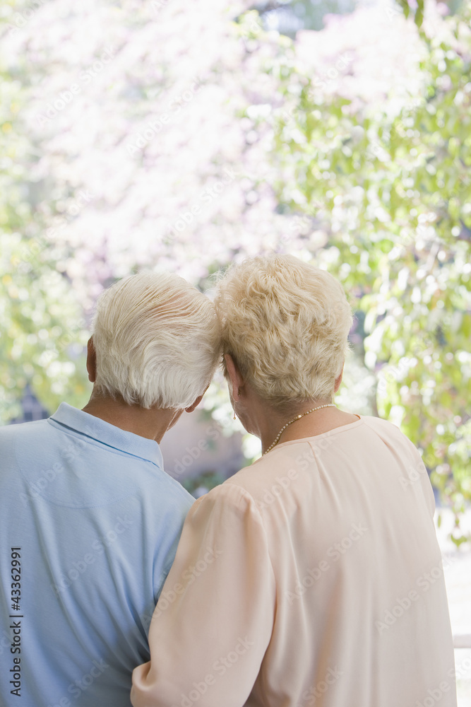Senior Hispanic couple standing arm in arm Senior Hispanic couple standing arm in arm
