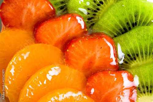 cheesecake with orange, kiwi and strawberry photo