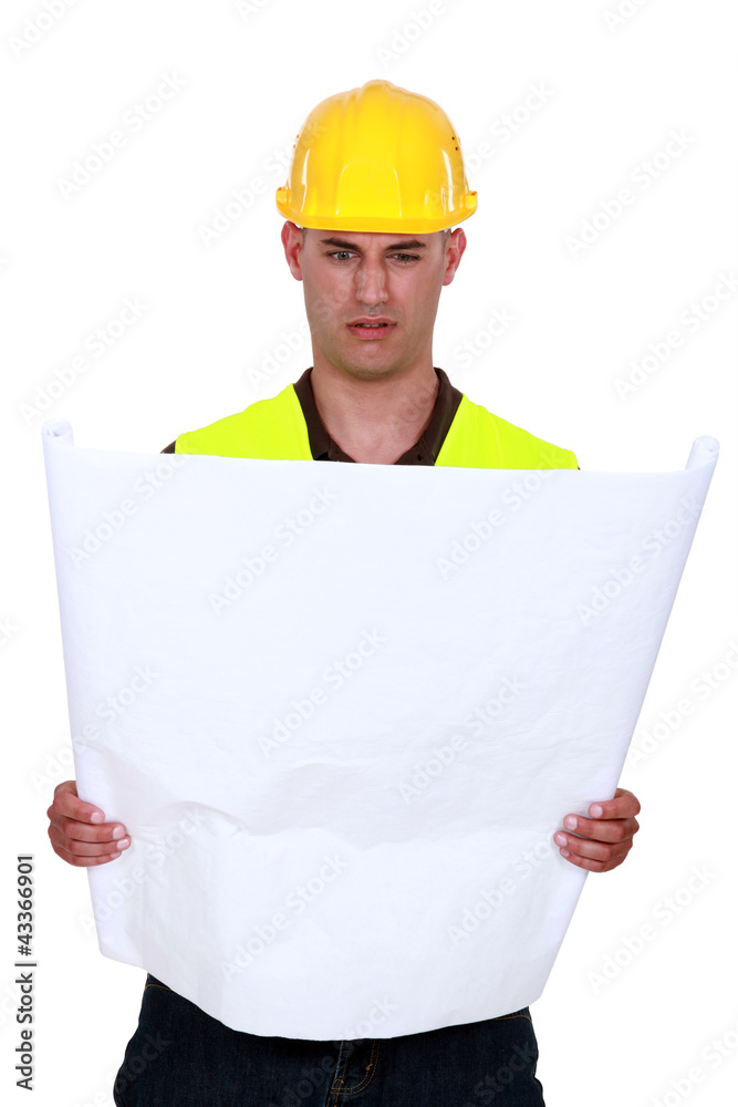 craftsman trying to understand a blueprint craftsman trying to understand a blueprint