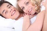 Close up of a young couple lying down