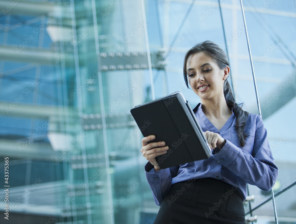 Caucasian businesswoman using digital tablet Caucasian businesswoman using digital tablet