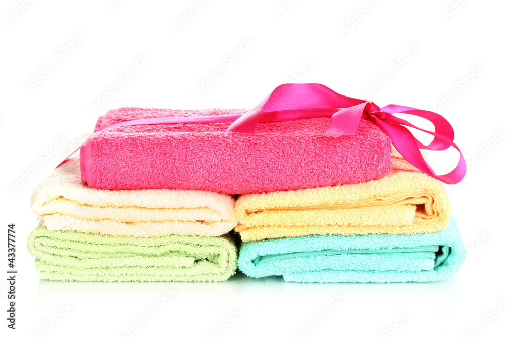 Colorful towels with ribbon isolated on white Colorful towels with ribbon isolated on white