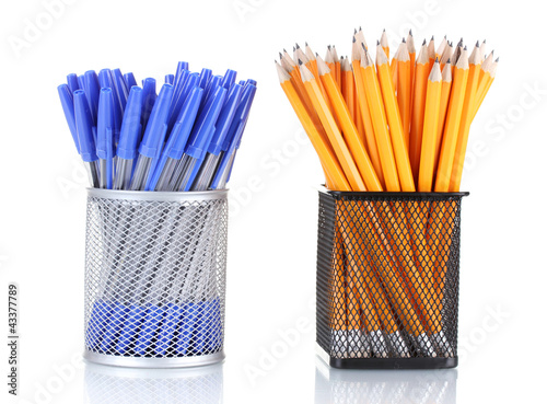 lead pencils and pens in metal cups isolated on white