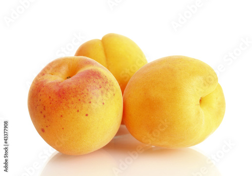 ripe sweet apricots isolated on white