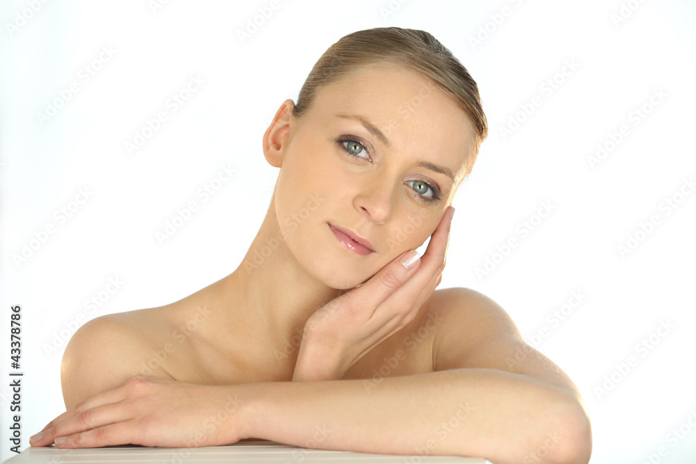 Portrait of a woman stroking her face Portrait of a woman stroking her face