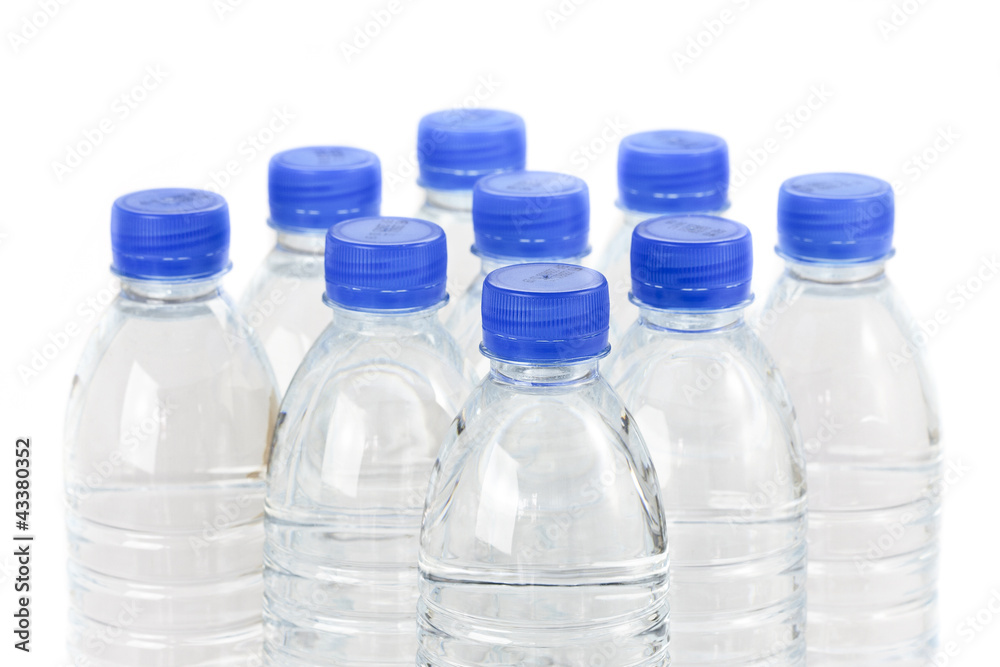 Rows of water bottles isolated on white background Rows of water bottles isolated on white background