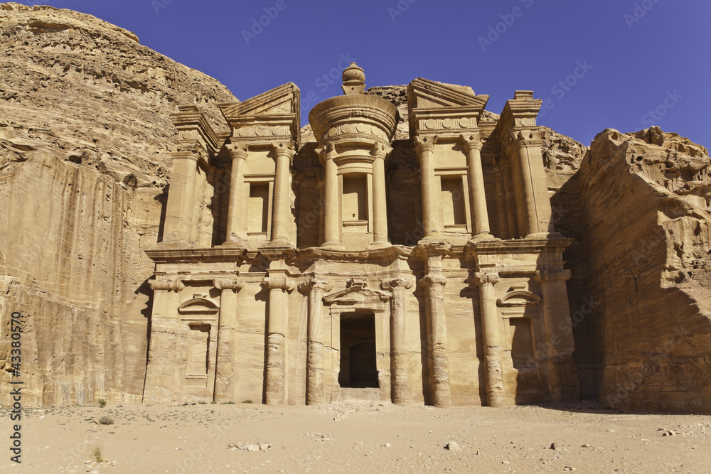 the facade of monastery in petra, jordan