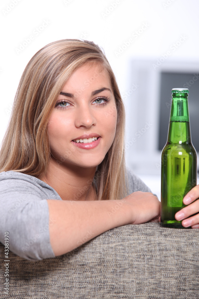 Teenager with a bottle of beer Teenager with a bottle of beer