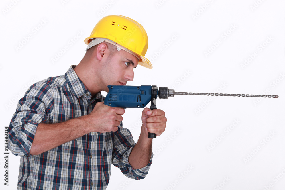 Man using power drill Man using power drill