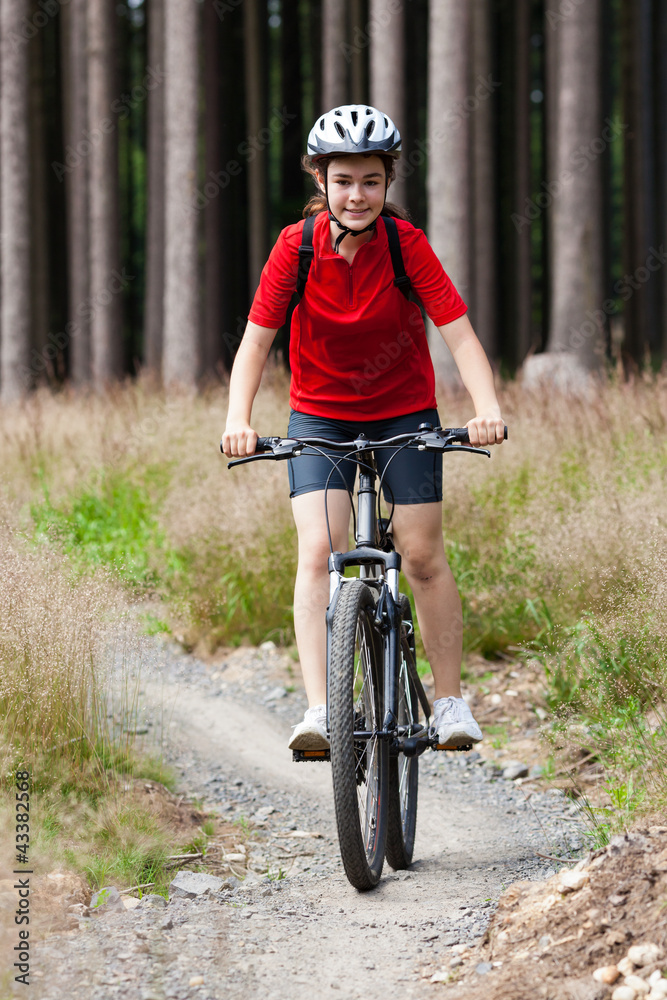 Obraz premium Girl biking