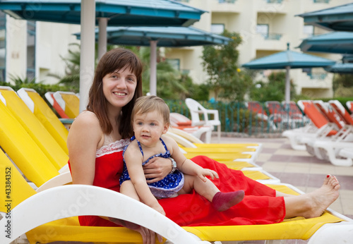 happy mother with toddler at resort
