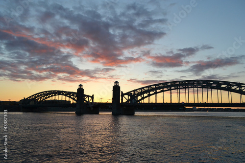 Neva river and Bridge Peter the Great at sunset