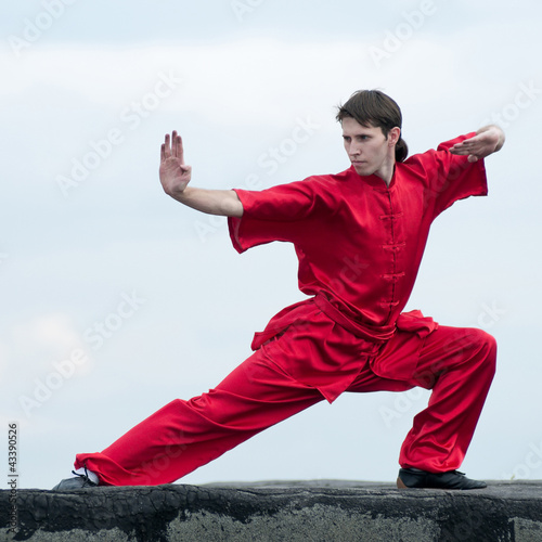 Wushoo man in red practice martial art photo