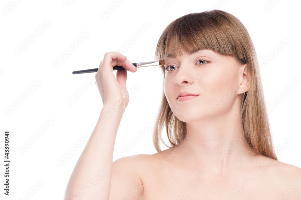 Fototapeta premium Beautiful woman with make up brush
