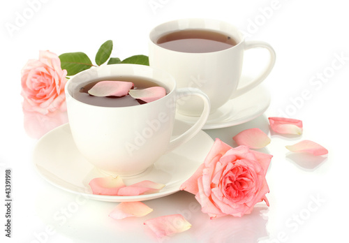 cups of tea with roses isolated on white