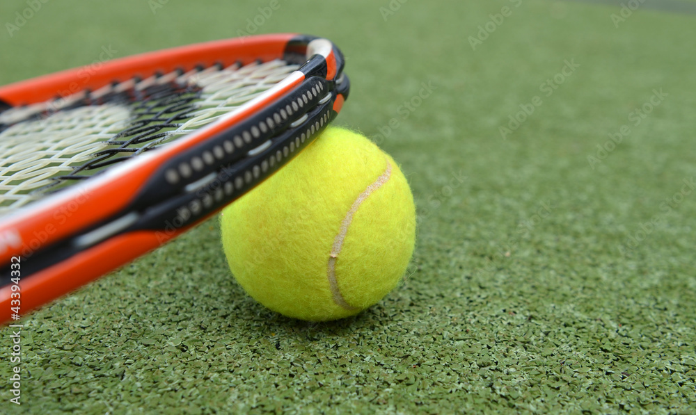 Tennis racquet and ball