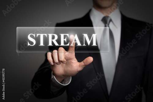 businessman pressing virtual button - stream