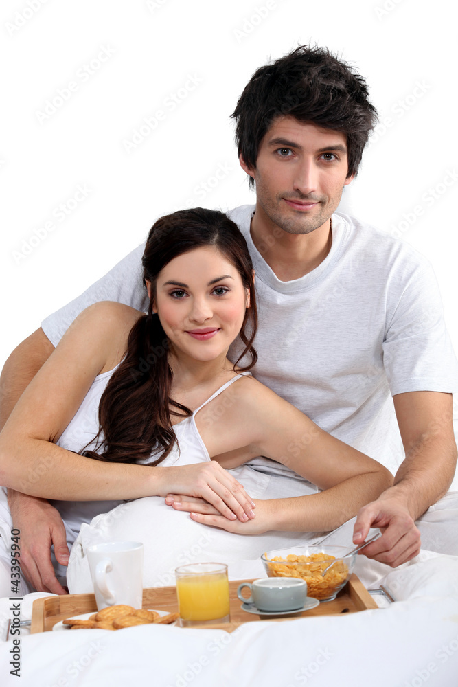 couple having breakfast in bed