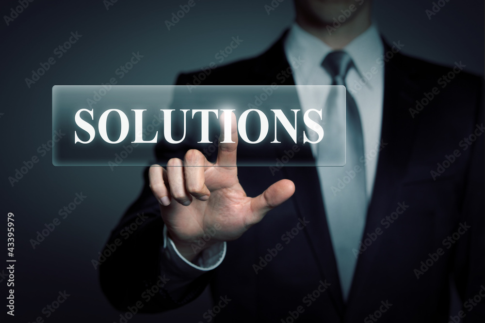 businessman pressing virtual button - solutions businessman pressing virtual button - solutions