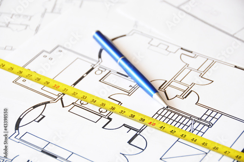 Pen and ruler on a floor plan