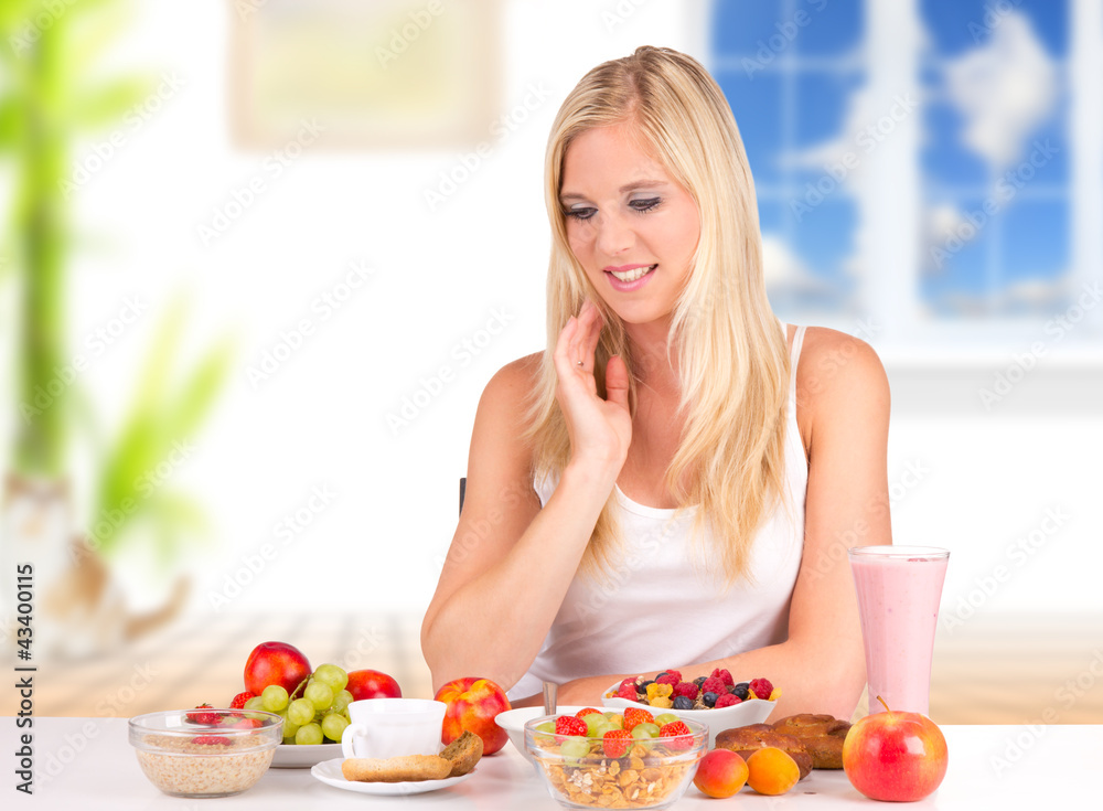 Attractive young woman having healthy breakfast Attractive young woman having healthy breakfast