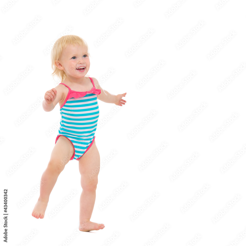 Smiling baby in swimsuit dancing Smiling baby in swimsuit dancing