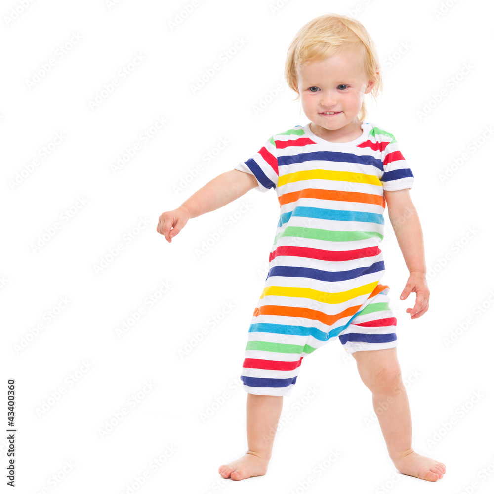 Full length portrait of cheerful baby in swimsuit Full length portrait of cheerful baby in swimsuit