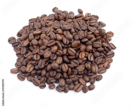 Heap of coffee beans at white background