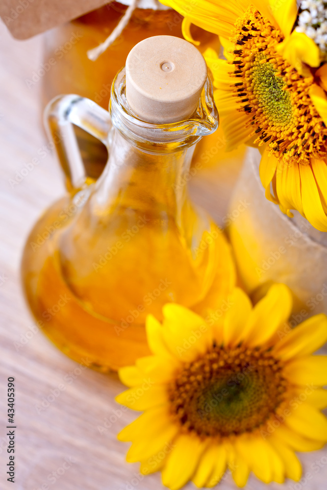Pitcher with sunflower oil, and flowers Pitcher with sunflower oil, and flowers