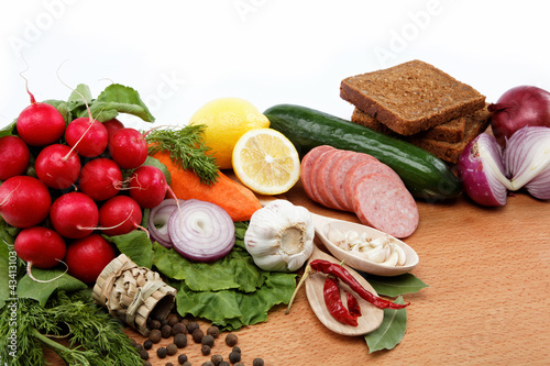 Healthy food. Fresh vegetables and fruits on a wooden board.