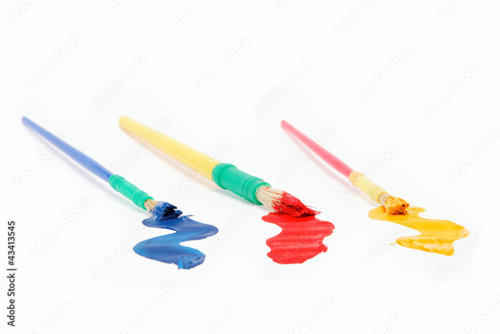 Brushes and paints isolated on a white background. Brushes and paints isolated on a white background.